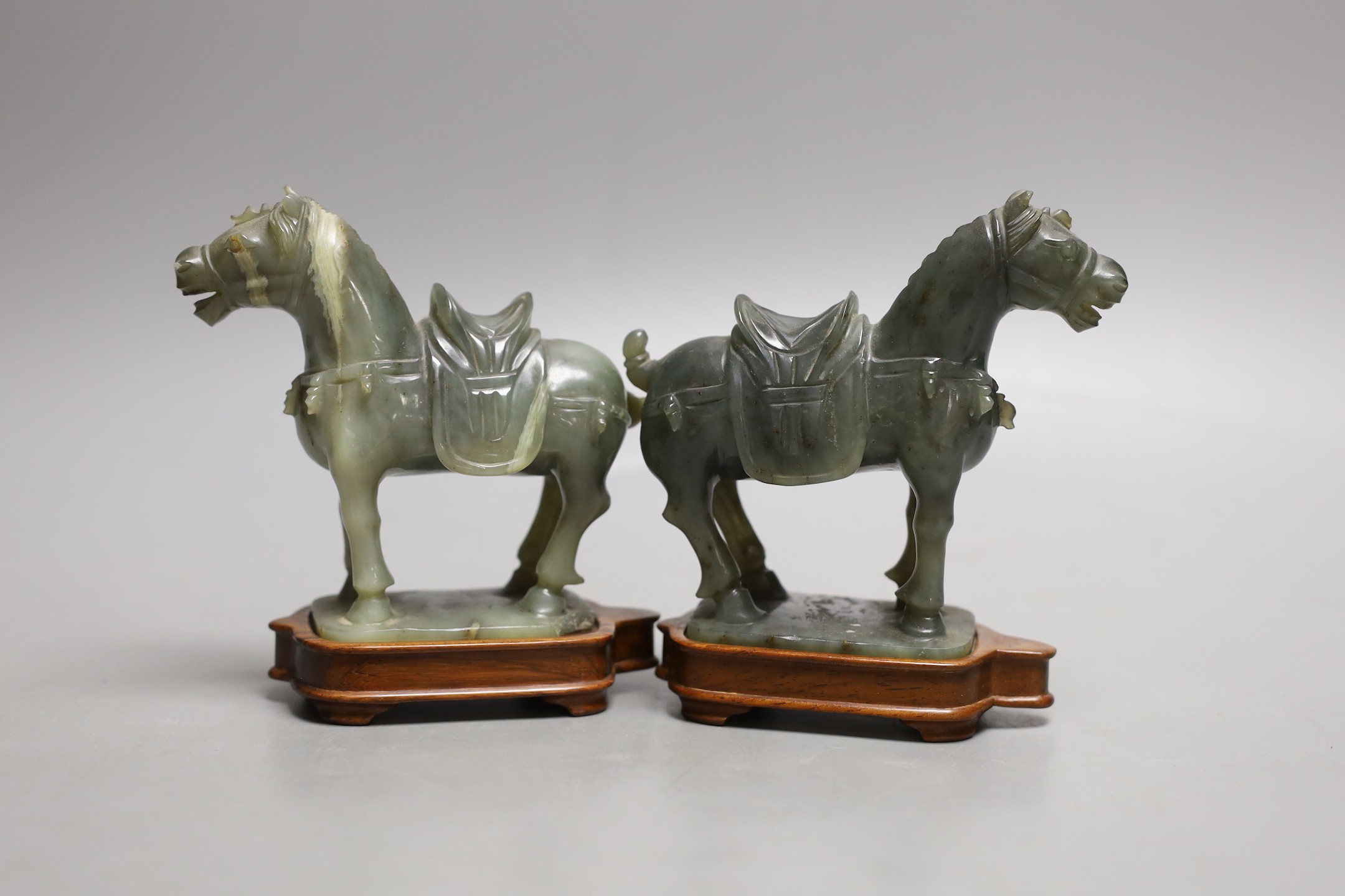 A pair of 20th century Chinese celadon jade figures of horses - 12cm tall